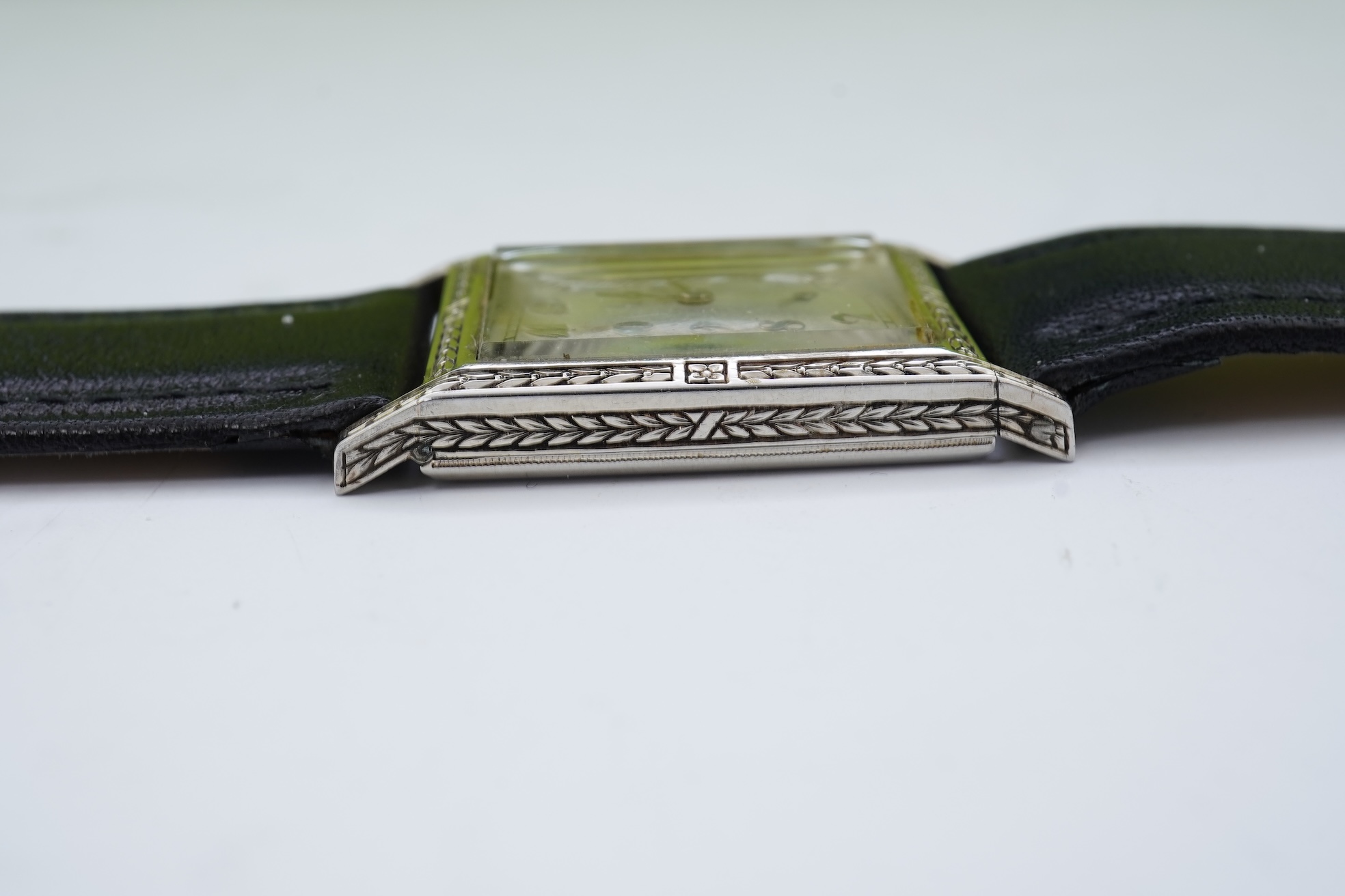 A lady's 18k white gold International Watch Company manual wind wrist watch, on a later associated leather strap